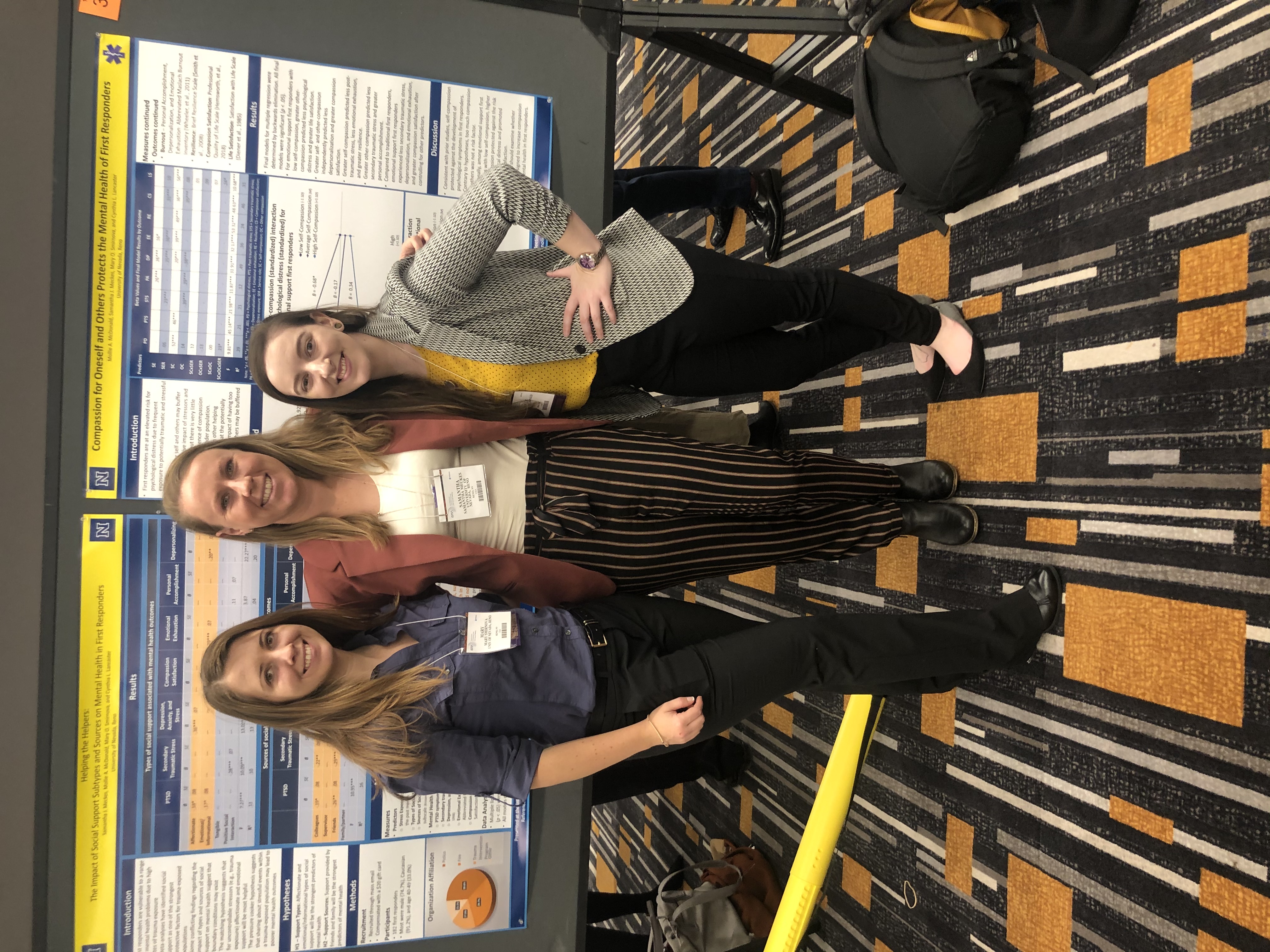 Graduate Students at a poster presentation